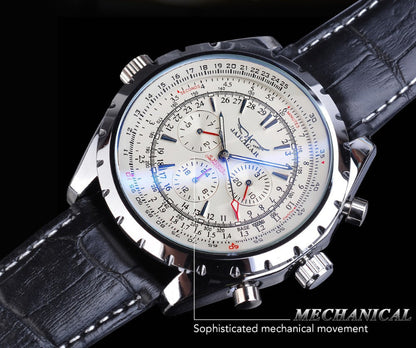 Mechanical watch with detailed face and black leather strap on a dark background