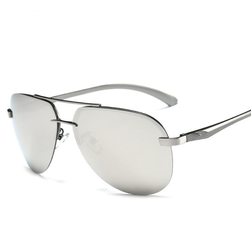 Silver sunglasses with reflective lenses on a white background