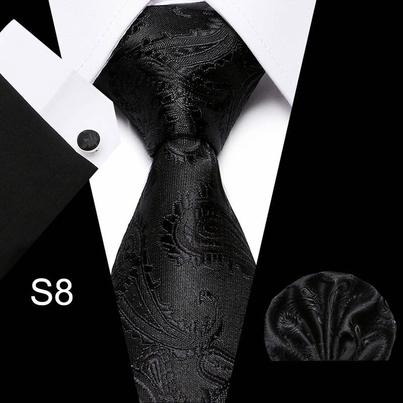 Men's business tie in black with subtle embossed floral and vine pattern