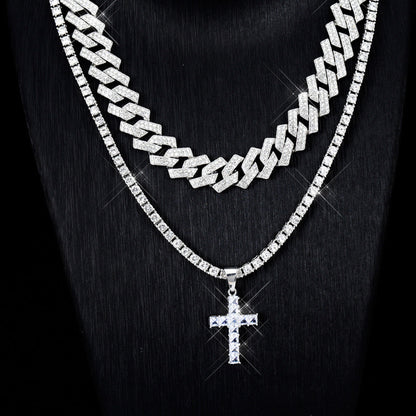 Silver chain necklace with a cross pendant on a black background