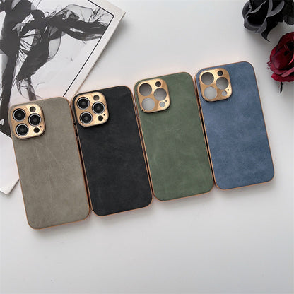 Four phone cases in different colors on a light surface with a magazine and flowers in the background.