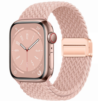 Smartwatch with a pink woven band on a white background
