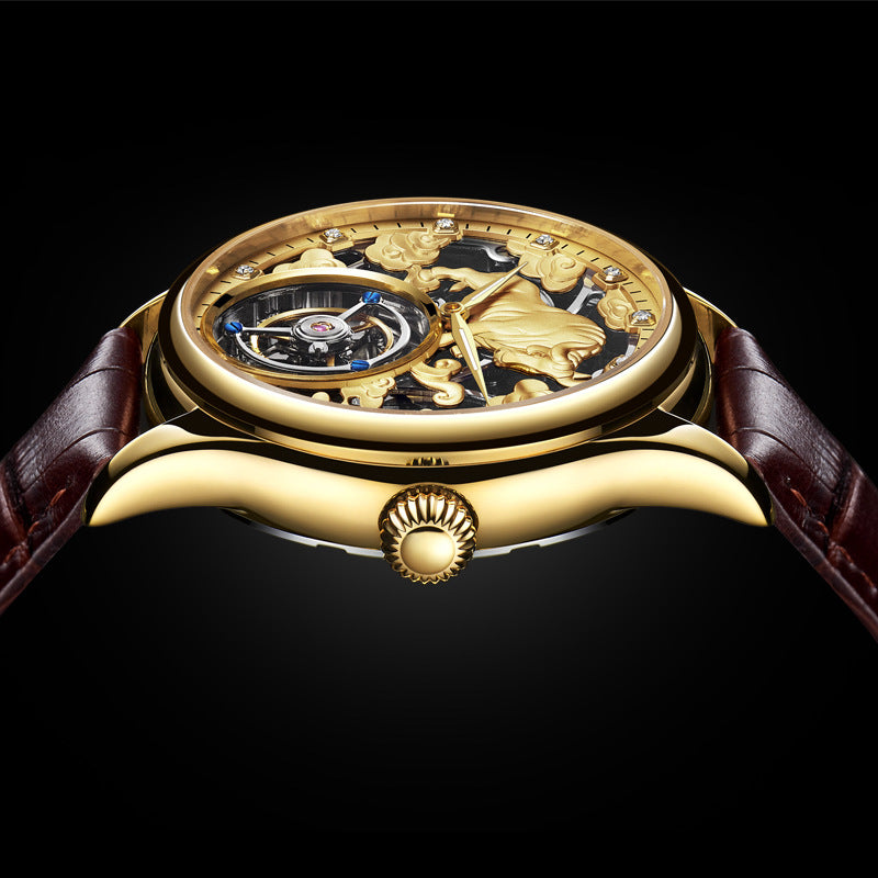 Gold-tone mechanical tourbillon wristwatch with brown leather strap, crown side view