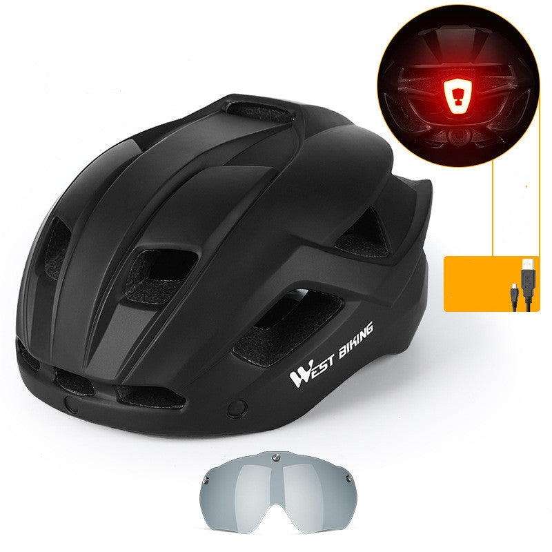 Cycling helmet with integrated goggles, matte black shell with tinted lens