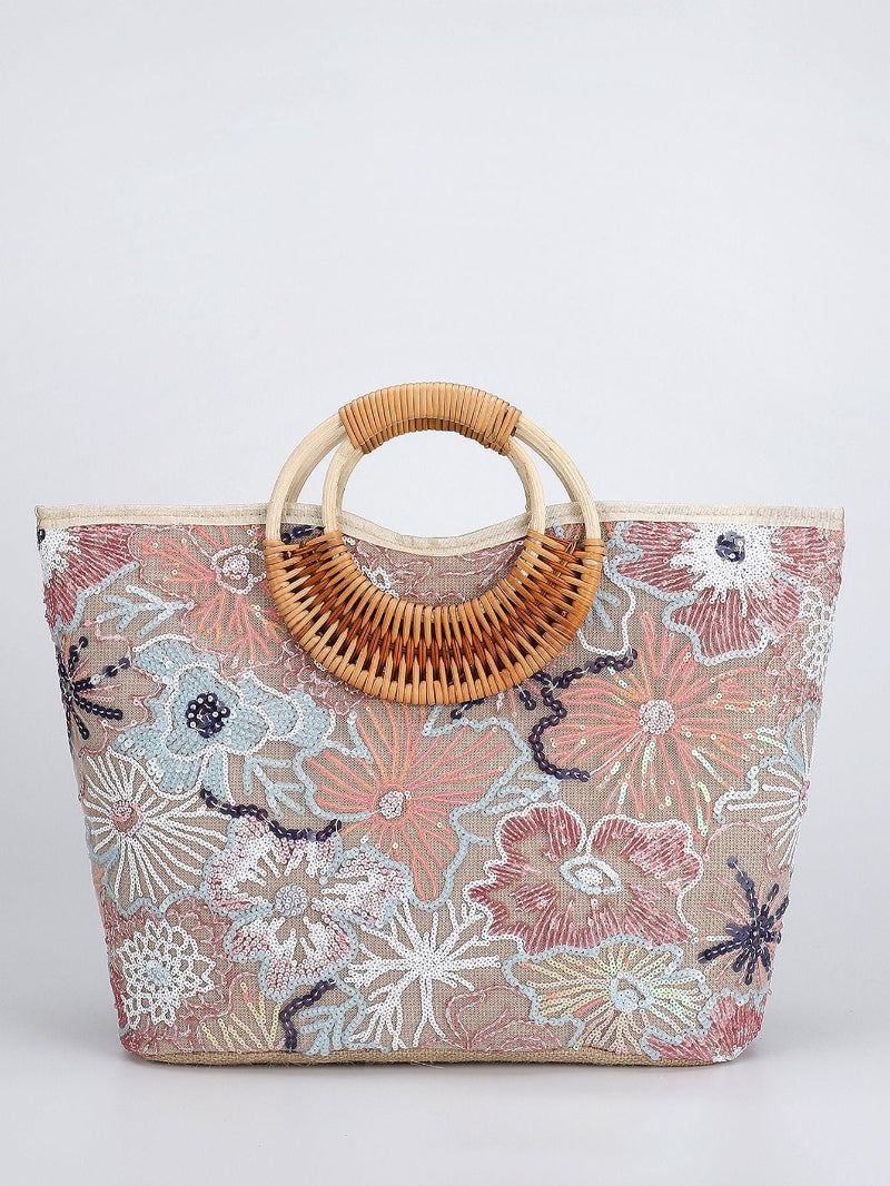 Large woven cotton tote bag with floral print and woven rattan top handles, pink and blue