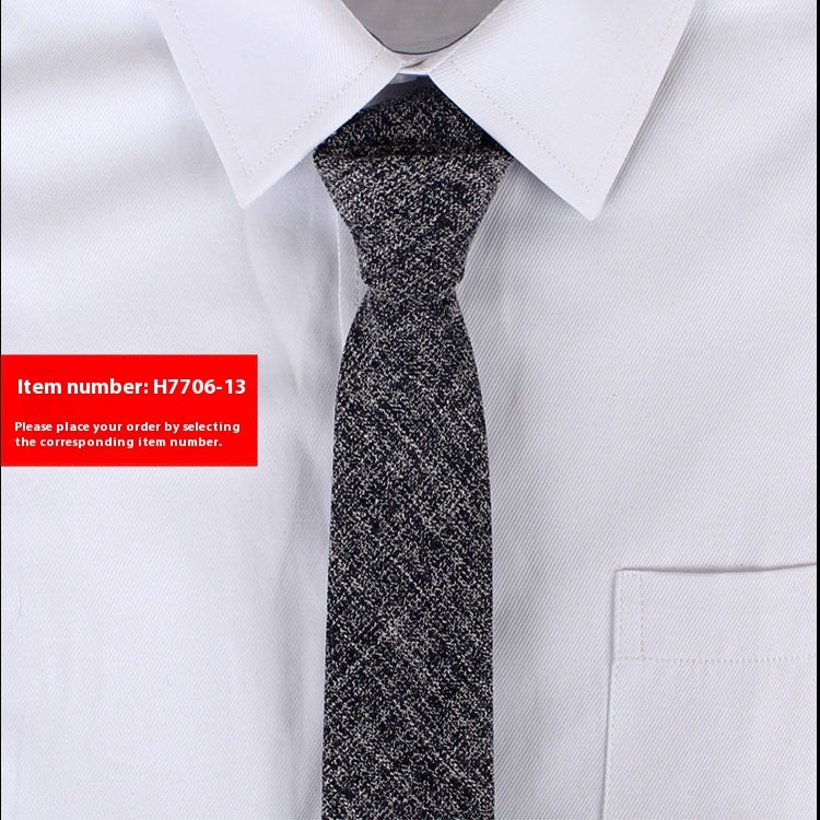 Narrow cotton tie in charcoal-black speckled textured weave