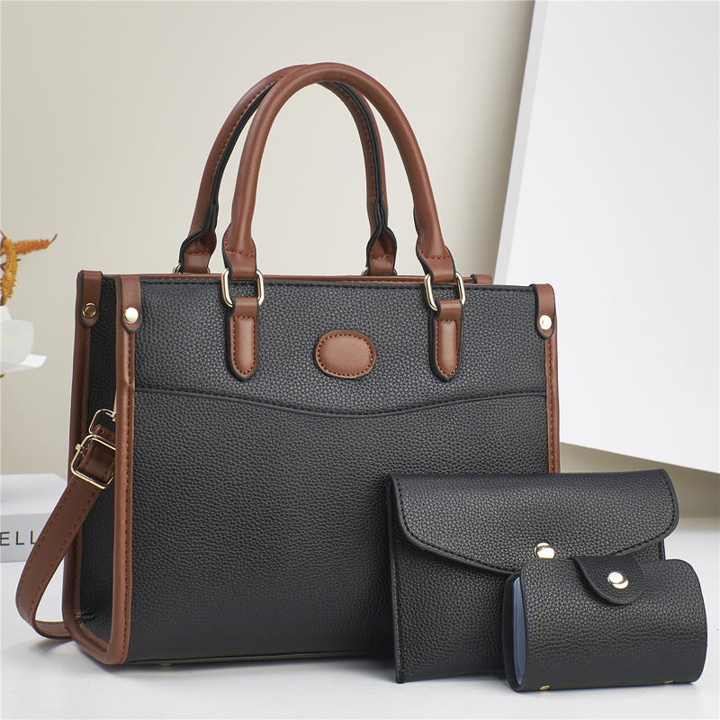 Three-piece shoulder bag set in dark gray with tan trim: structured tote plus two pouches