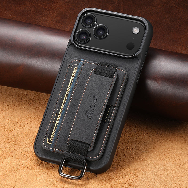 Black phone case with card holder and strap on a brown leather background