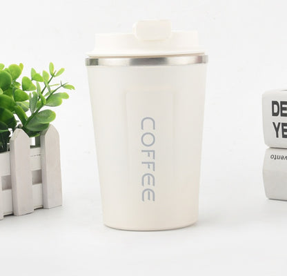 White coffee tumbler with 'COFFEE' text on a white background