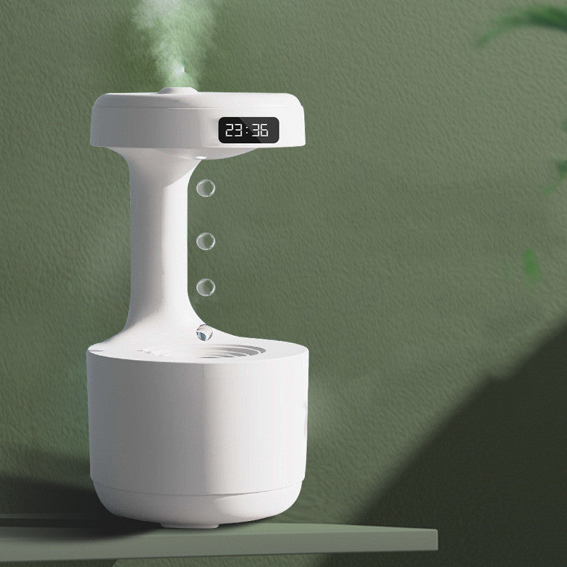 White anti-gravity humidifier with LED time display and mist outlet on base