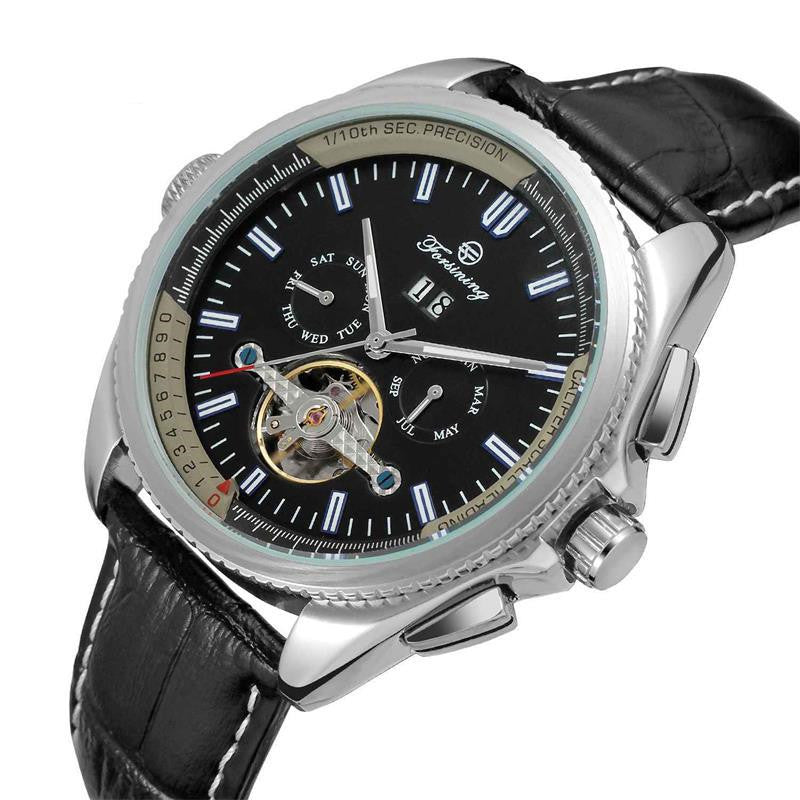 Luxury watch with black leather strap and detailed face on a white background