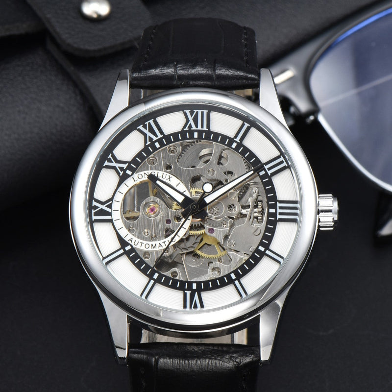Mechanical watch with black leather strap on a dark background