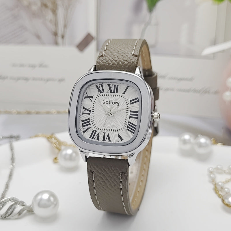 Women’s retro Roman dial leather strap watch with silver case and brown leather strap.