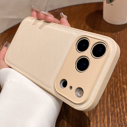 Beige phone case with multiple camera lenses held by a person on a wooden surface.