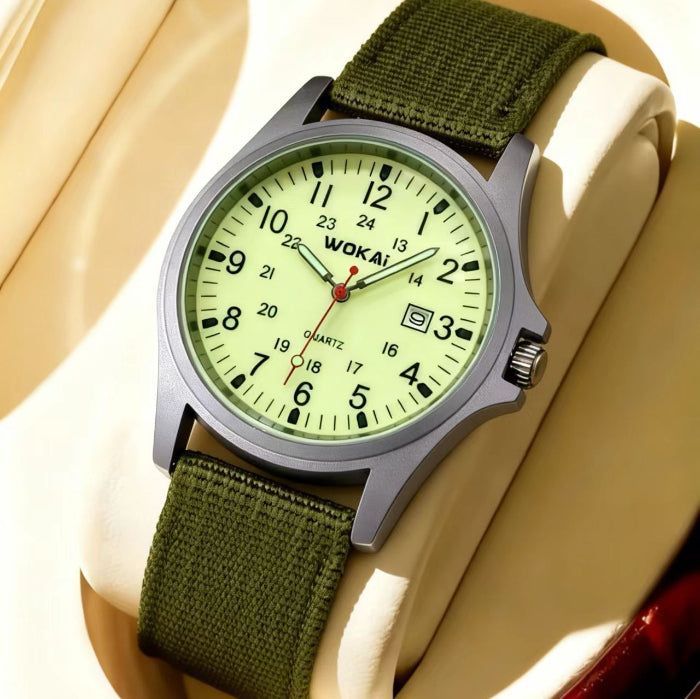 Quartz wristwatch with olive canvas strap and lime green dial, date window at 3 o’clock.
