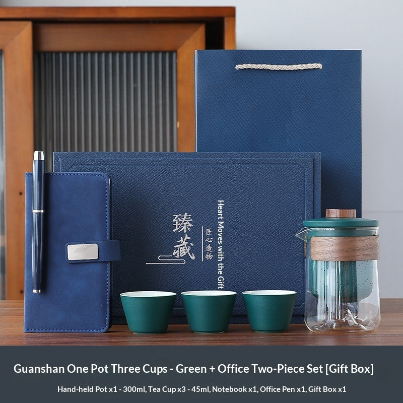 Blue office gift set with green tea cups, notebook, pen, and tea pot in gift box