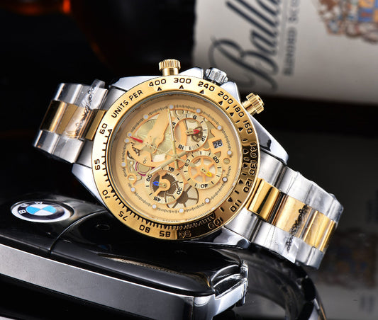 Men's quartz watch with steel link strap, champagne dial, gold-tone bezel.