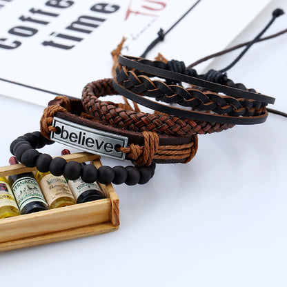 Set of braided bracelets with a 'believe' charm on a white surface with coffee-themed decor.