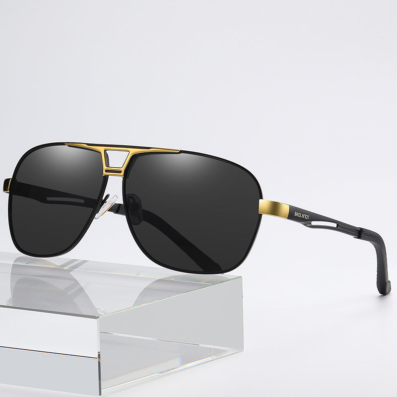 Polarized sunglasses with black lenses and gold square bridge detail
