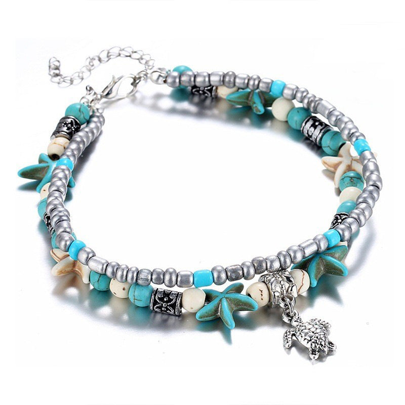 Turquoise and silver beaded anklet with starfish charms and small animal charm