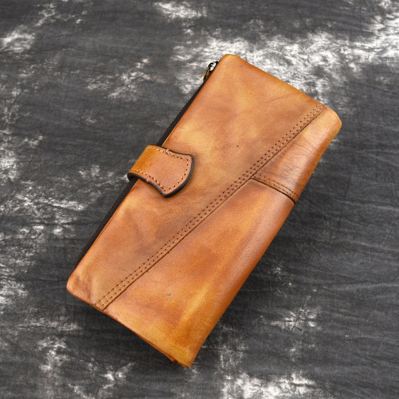 Brown leather wallet on a textured gray background