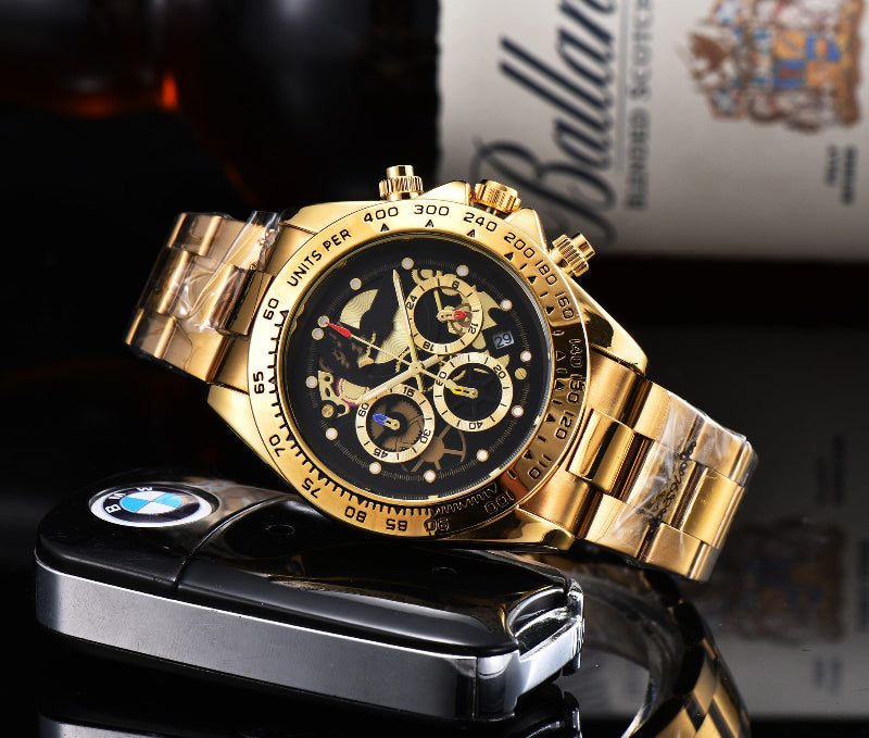 Men's quartz watch with steel link strap, black dial, gold-tone bezel and markers.