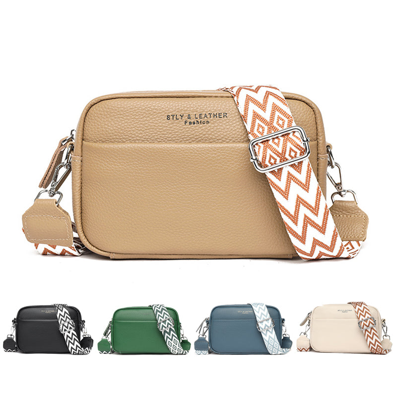 Beige faux leather crossbody bag with chevron strap and metal buckle clasp