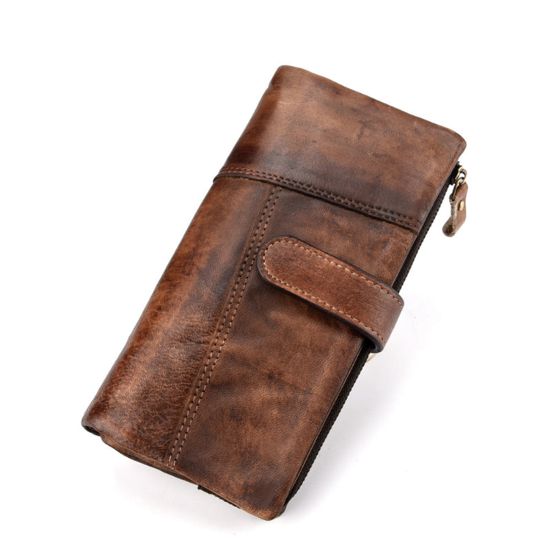 Brown leather wallet with a zipper on a white background