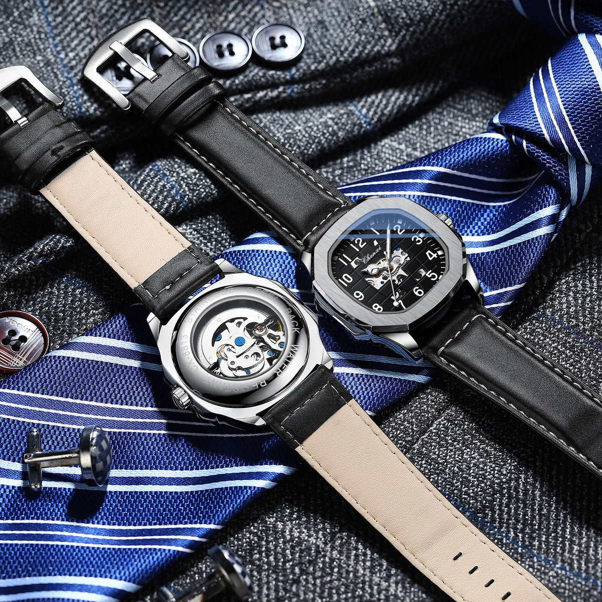 Square mechanical watches on blue-striped fabric, black leather strap and light tan strap