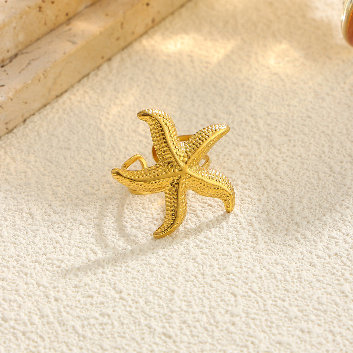 Gold 18K vacuum-plated starfish motif ring with textured surface