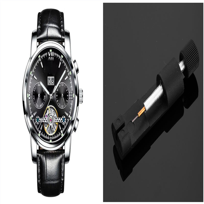 Black wristwatch with detailed face and black leather strap, alongside a close-up of a watch battery.