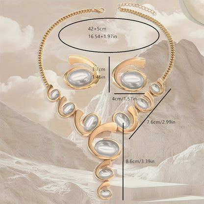 Gold necklace with pearl-like stones on a beige marble background