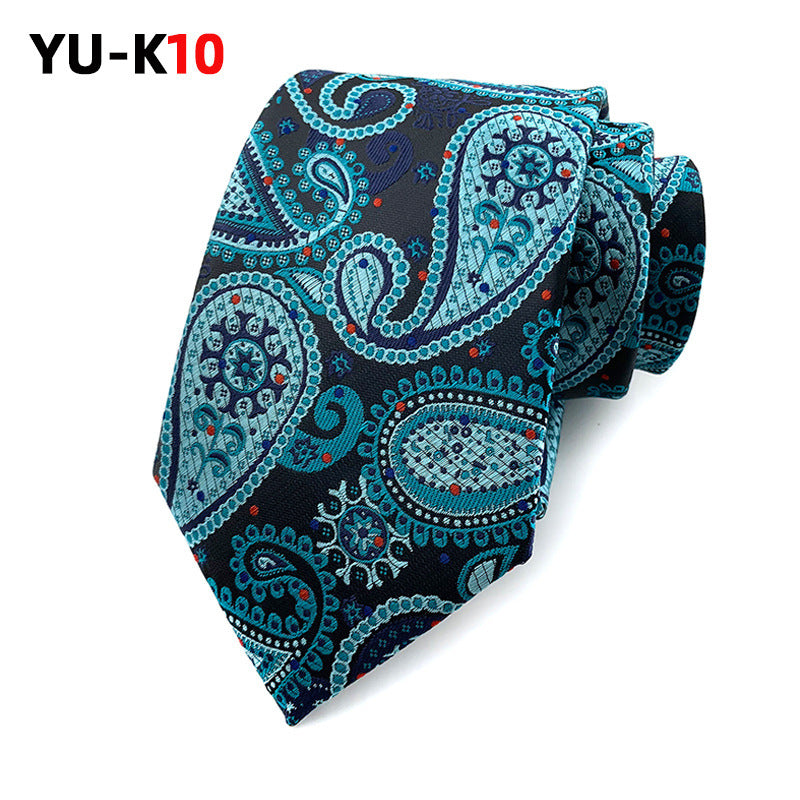 Blue paisley patterned tie on a white background with 'YU-K10' branding.