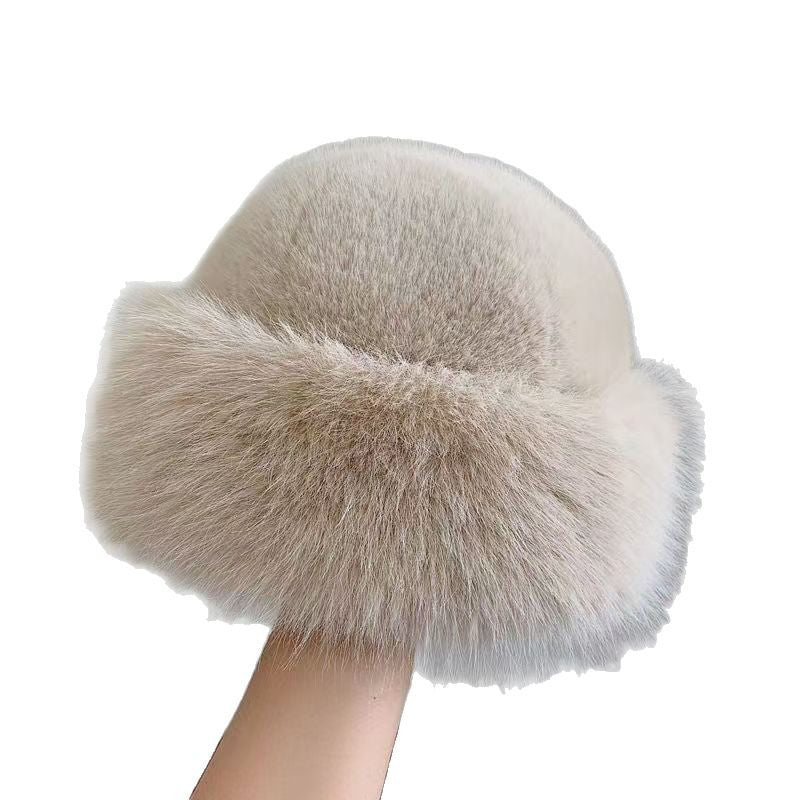 Furry beige hat with a white background