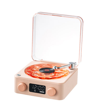 Small record player with a clear lid on a white background
