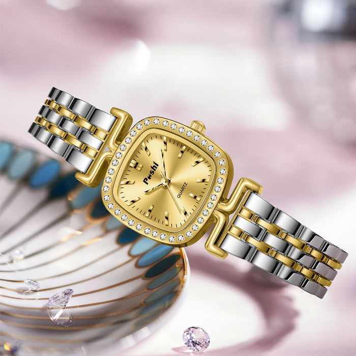Women’s quartz watch with diamond bezel, gold dial, and two-tone metal bracelet
