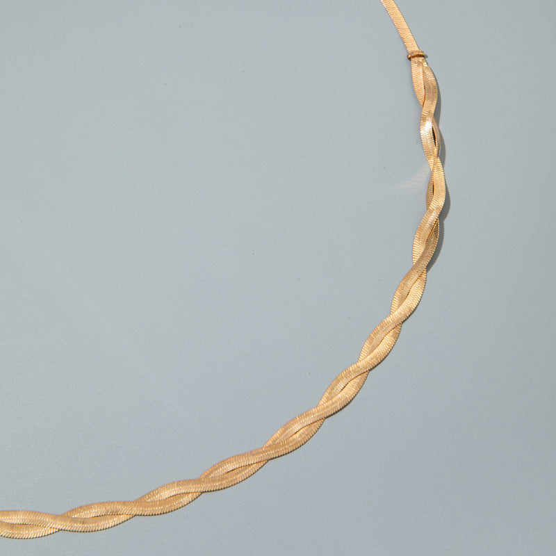 Gold twisted snake-chain belt strand with textured linked detail