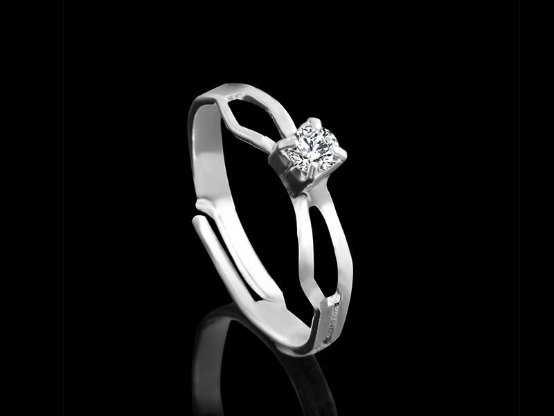 Silver-tone ring with central square rhinestone and side stones