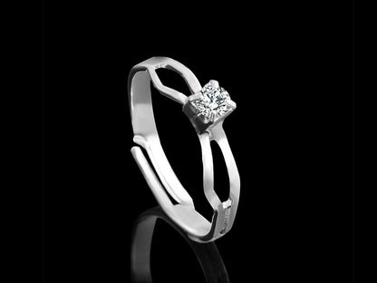 Silver-tone ring with central square rhinestone and side stones