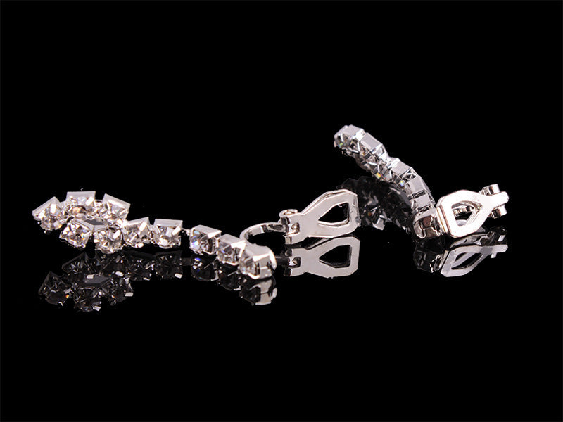 Rhinestone bracelet with silver-tone linked chain and metal clasp