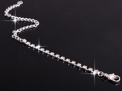 Rhinestone tennis bracelet with silver-tone chain and lobster clasp