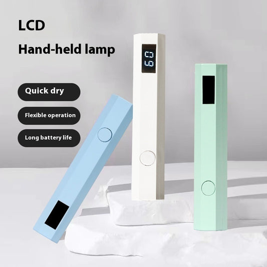 Three nail dryer lamps with LCD displays on a light gray background