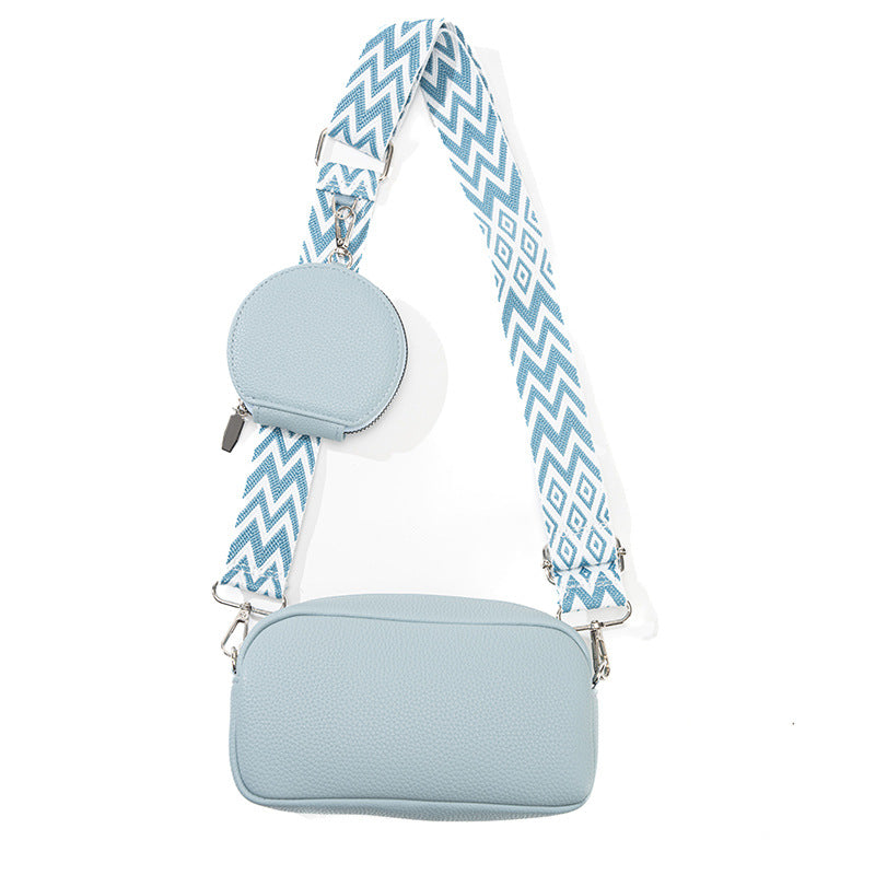 Women's casual crossbody bag in light blue with zip closure and chevron strap
