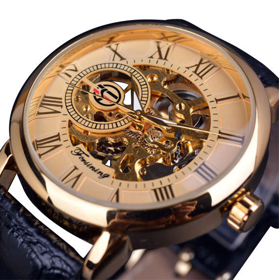 Gold wristwatch with visible mechanism on a white background