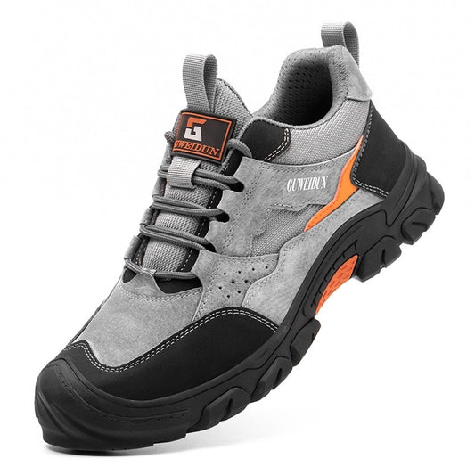 Gray and black hiking shoe with orange accents on a white background
