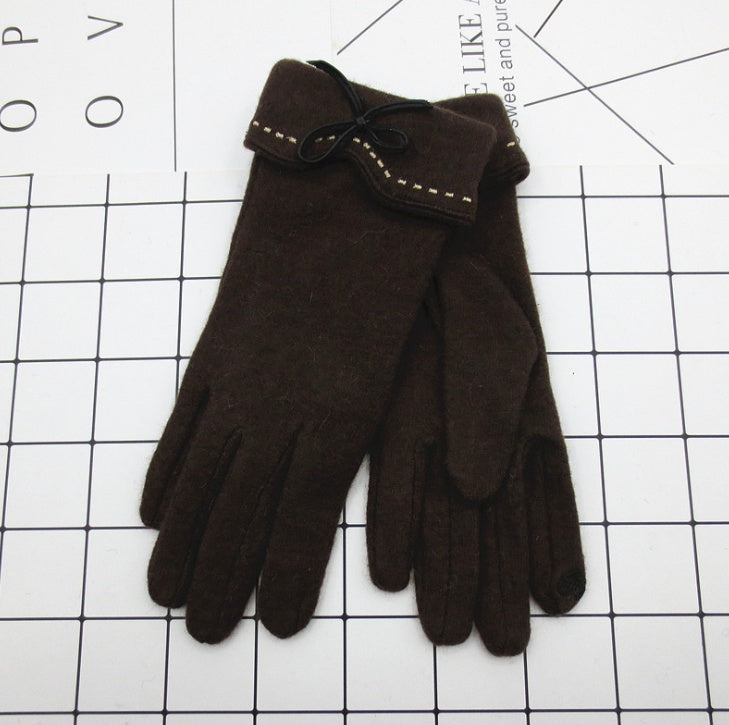 Brown gloves on a white grid background