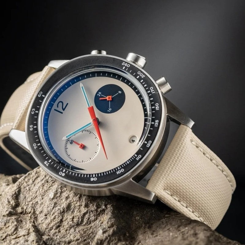 Beige leather quartz wristwatch with round dark case and white chronograph dial