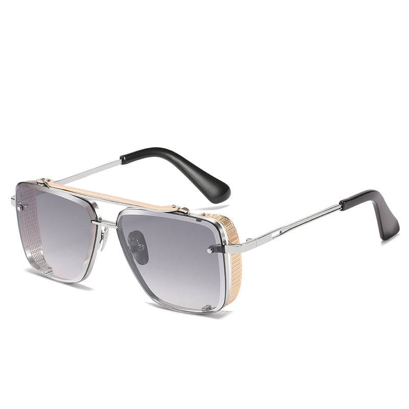 Sunglasses with a gold and black frame on a white background