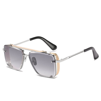 Sunglasses with a gold and black frame on a white background