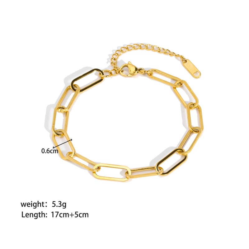 Gold-tone curb link bracelet with bar clasp and small chain extension